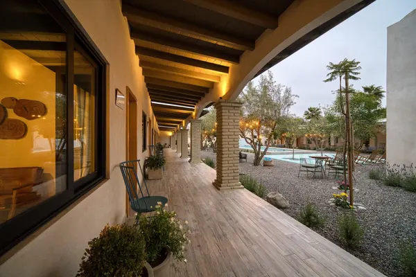 Hallway between rooms and pool